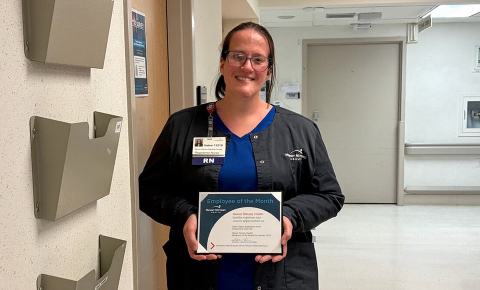 Hallee Chase poses with her employee of the month certificate